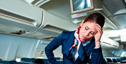 flight attendant, stewardess, plane, cabin, exhausted, frustrated, headache
