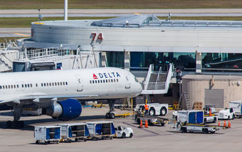 A Delta Air Lines aircraft sits parked at Orlando International Airport