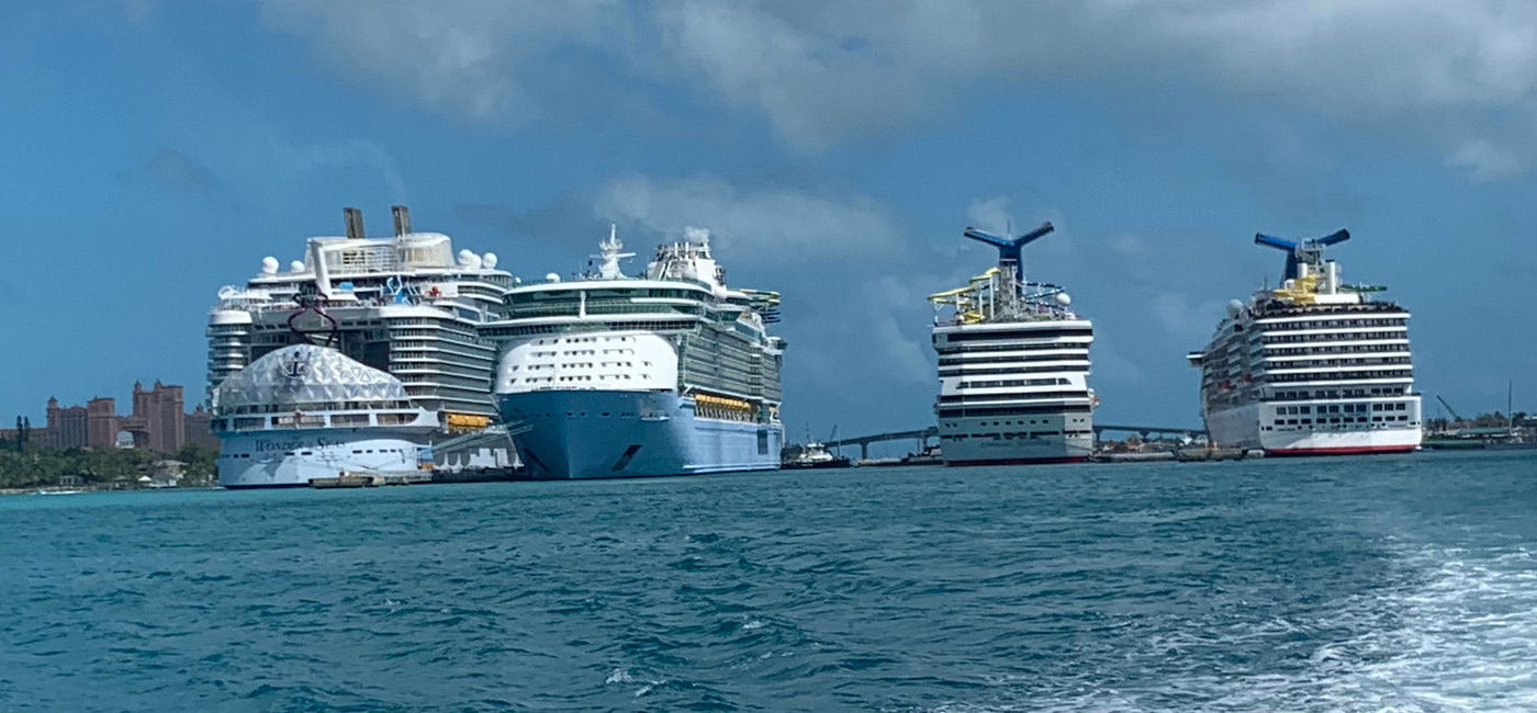 Image: Four ships docked in Nassau, including the new world's largest Wonder of the Seas (far left) and former titleholder Freedom of the Seas (second from left.) (Bruce Parkinson)