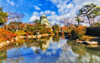 JP Osaka Castle pond during the day.