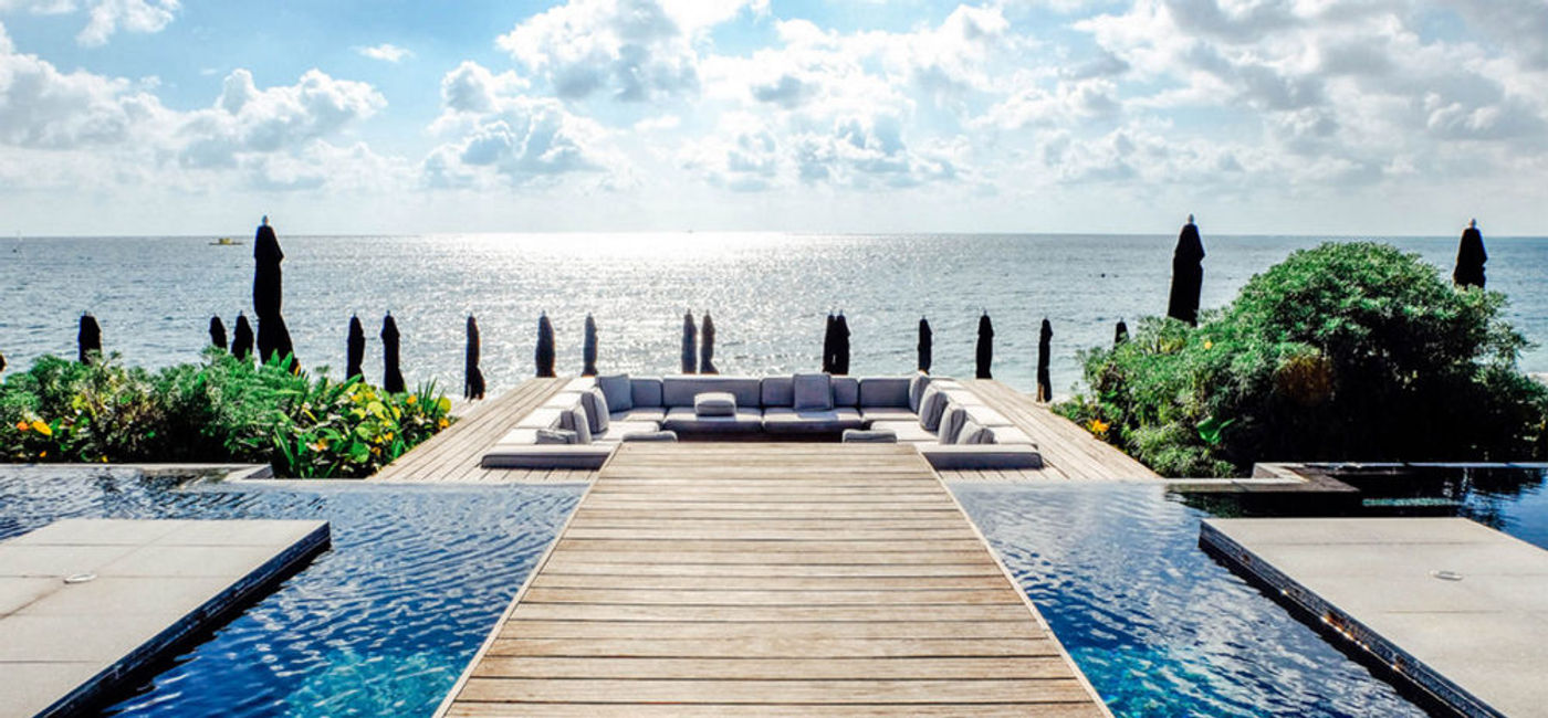 Image: PHOTO: Pool and shoreline sparkling in the sun at NIZUC Resort and Spa, Cancun. (photo by Michelle Rae Uy)