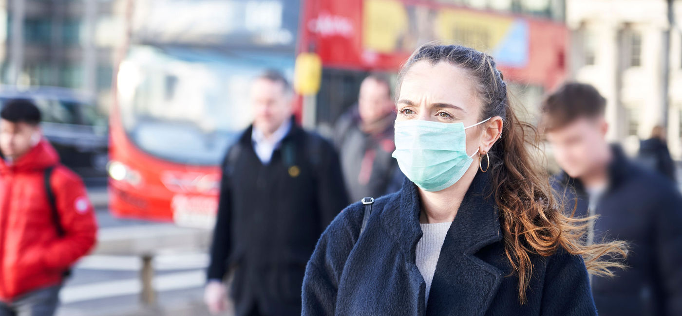 Image: PHOTO: Young woman in London wearing a hygenic mask. (Photo via iStock/Getty Images Plus/gemphotography)