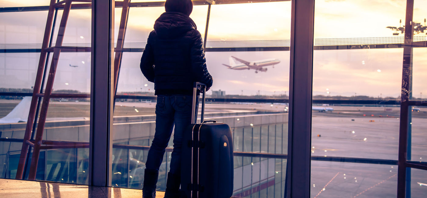 Photo: Passenger at airport in Beijing, China. (photo via 06photo / iStock / Getty Images Plus)