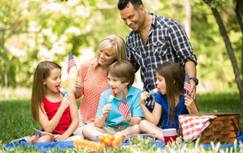 Family celebrating a U.S. national holiday with an outdoor picnic.