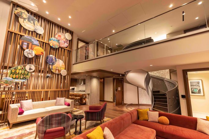 Multi-level villas sleep up to 12 guests, and offer a full-size kitchen with an island counter, a large dining room table, and a spacious living room.