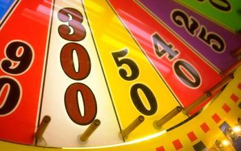Close-up of a spinning wheel-of-fortune arcade game.