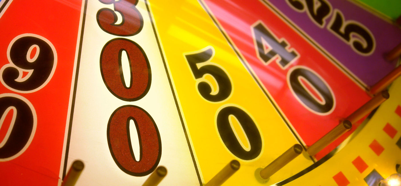 Image: PHOTO: Close-up of a spinning wheel-of-fortune arcade game. (Photo via iStock / Getty Images E+ / McKevin)
