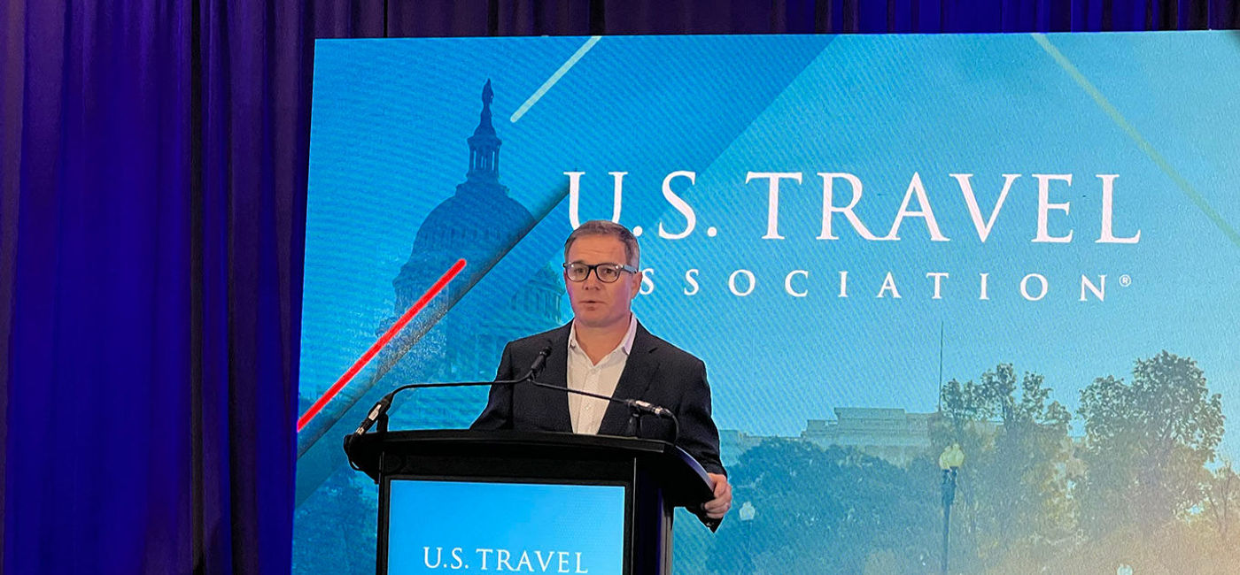 Image: Jeff Freeman, President and CEO of the United States Travel Association (USTA) speaking at IPW. (Photo Credit: Paul Heney)