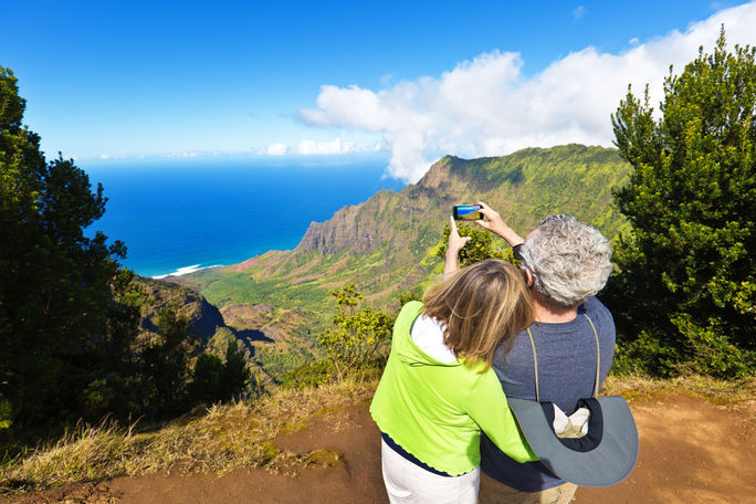 Tourist couple at Waimea Canyon State Park, Kauai, Hawaii