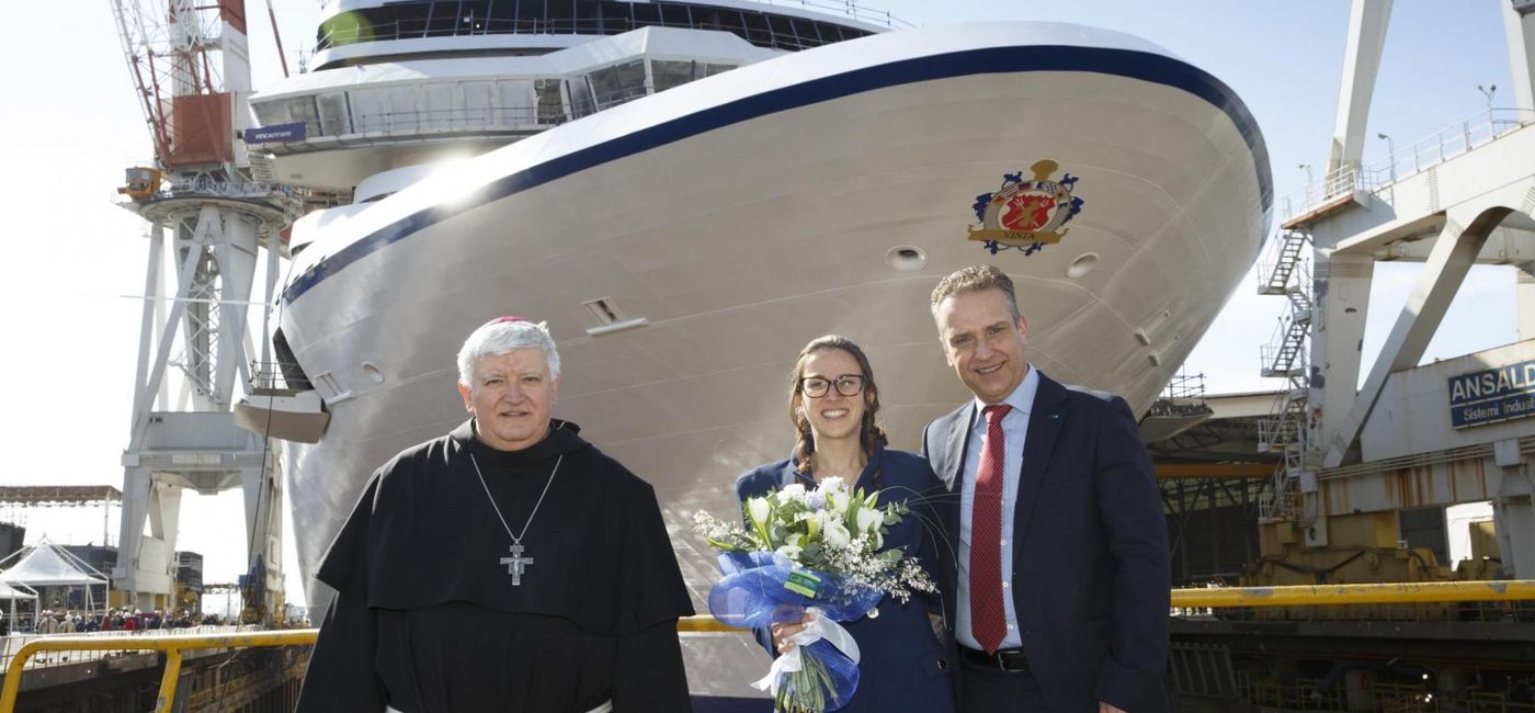 Image: Presiding over the Vista float-out were, from left, Monsignor Tasca, archbishop of Genoa; Madrina Anna Trucco; and Giuseppe Torrente, shipyard director for Fincantieri. (Photo courtesy of Oceania Cruises)