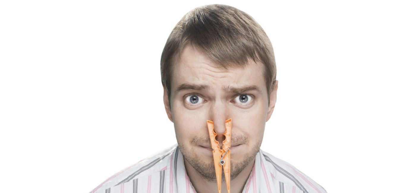 Image: PHOTO: Man with a clothespin. (photo courtesy of Thinkstock)