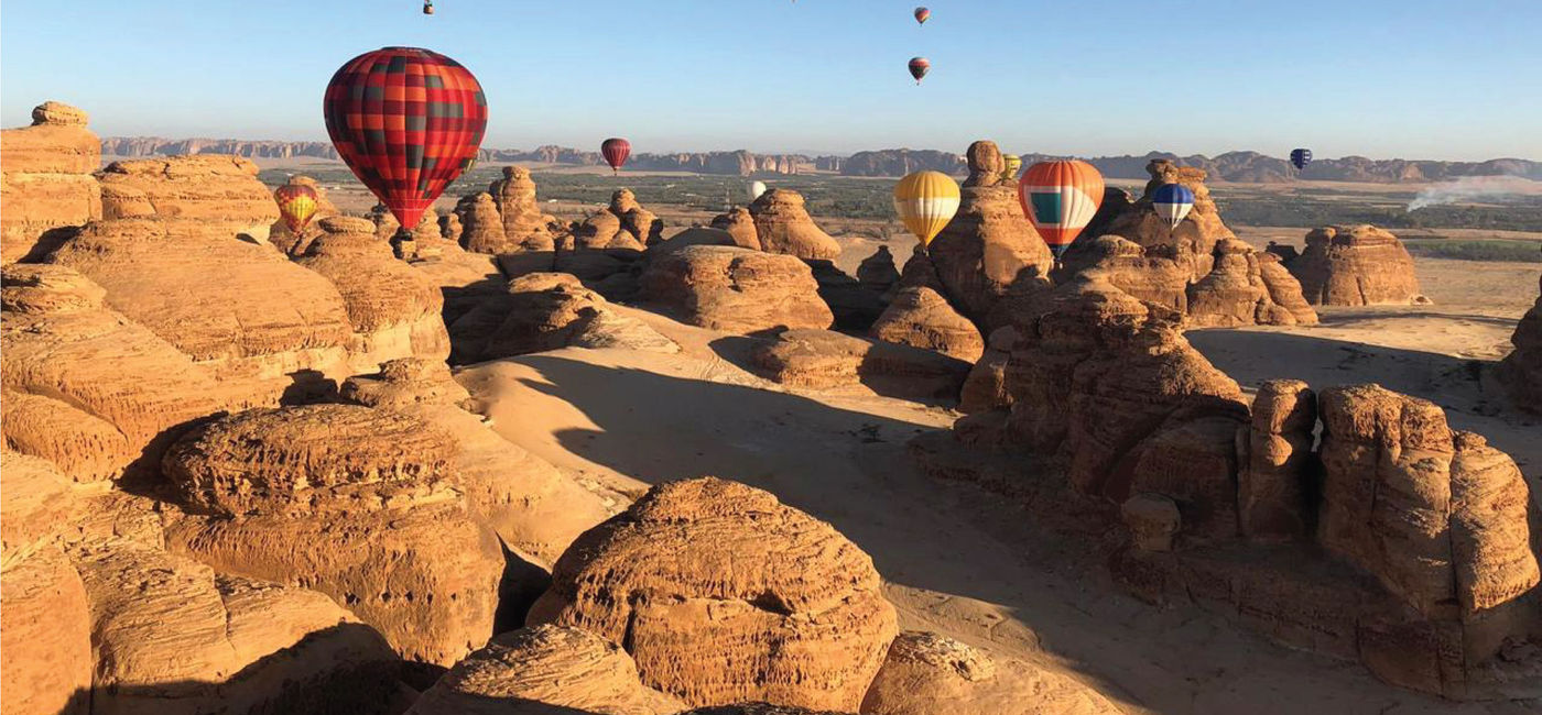 Image: Hot air balloons floating above a Saudi Arabian landscape. (photo courtesy of Saudi Tourism Authority)