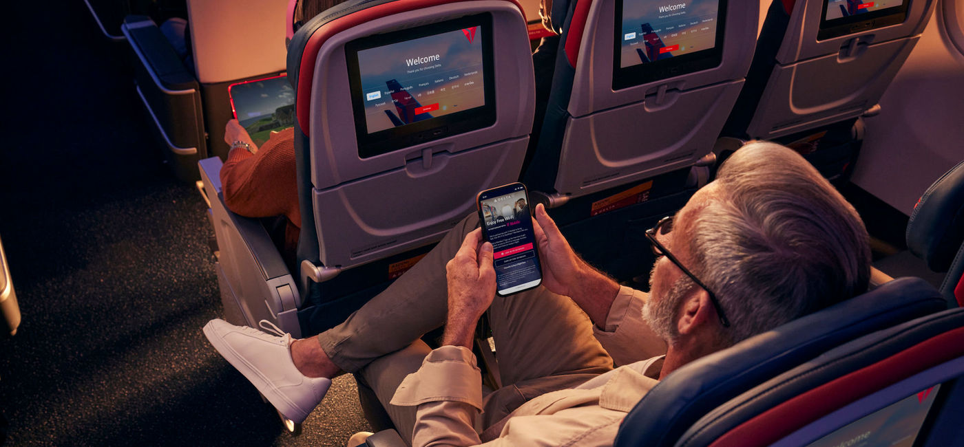 Image: A Delta customer connects to free Wi-Fi. (photo courtesy of Delta Air Lines)