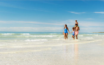Family walking on the beach