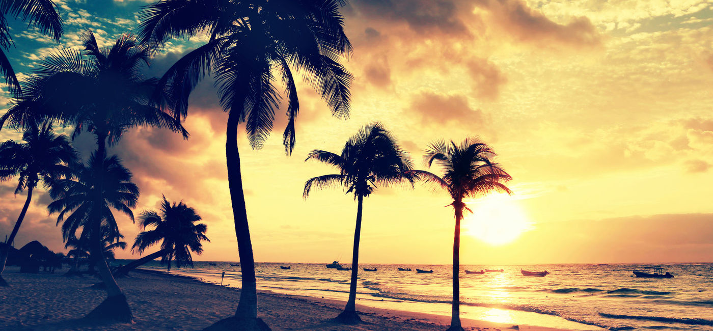 Image: Tulum beach at sunrise. (Photo Credit: IngaL / iStock / Getty Images Plus)