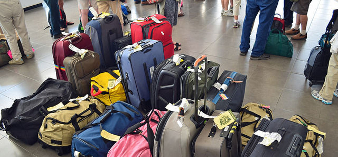 Image: PHOTO: Air passengers and their luggage received an unexpected and unappreciated dip in water at JFK. (photo via Flickr/Allen Sheffield)