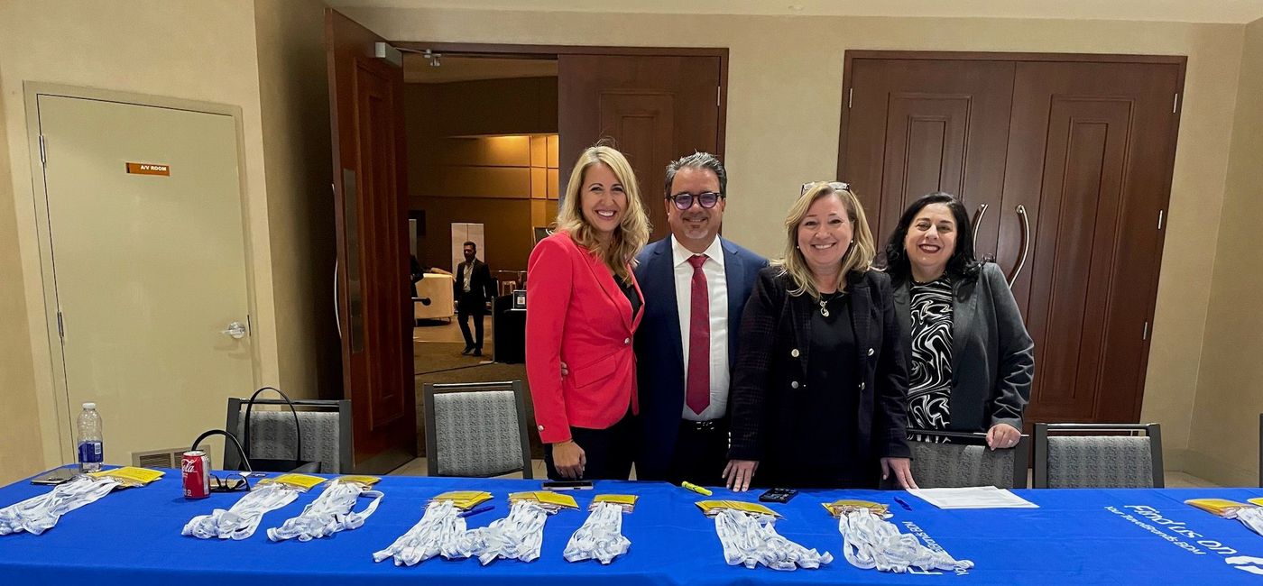 Image: TravelBrands CEO Frank DeMarinis and key members of his team ready to welcome travel advisors. (Bruce Parkinson)