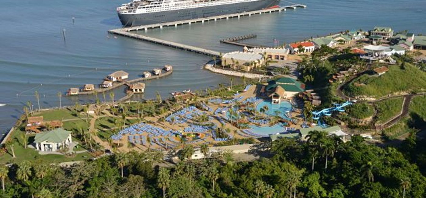 Image: PHOTO: Cunard's Queen Mary 2 docked at Amber Cove, Dominican Republic. (photo courtesy of Carnival Corporation & plc)