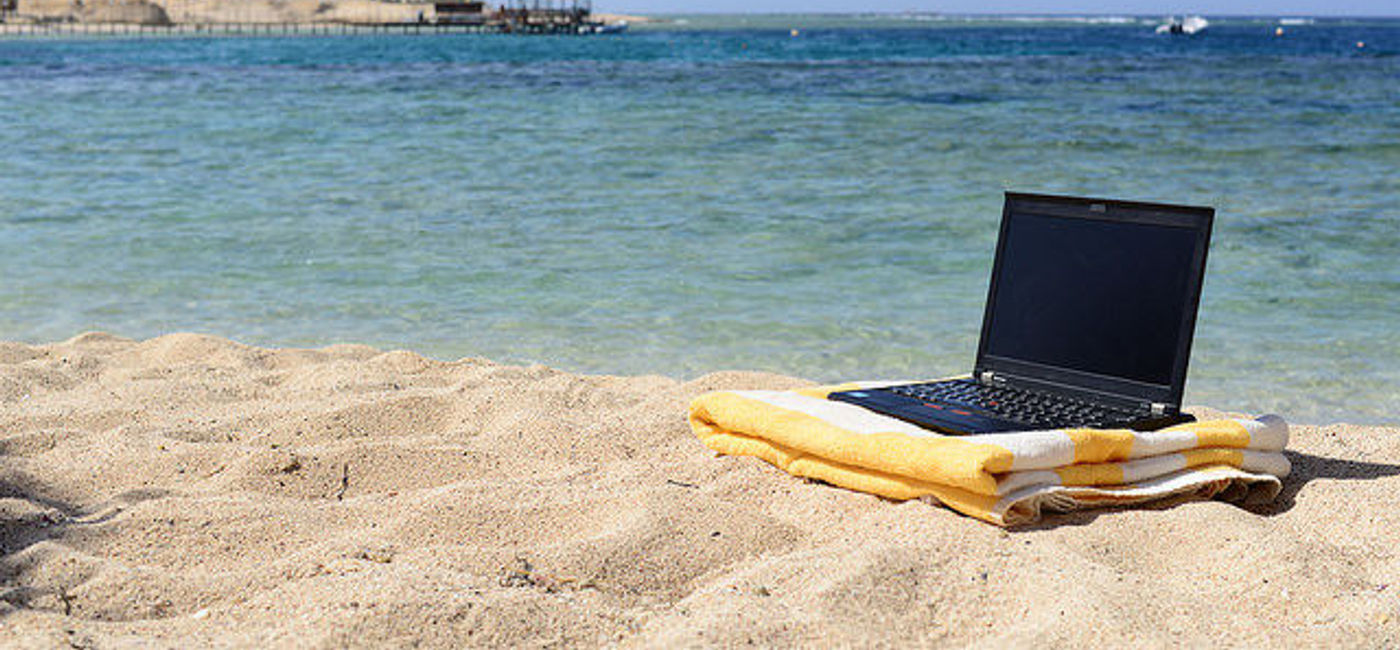 Image: PHOTO: Americans are fond of working while they play. (Photo via Flickr/Laura Hoffmann) 