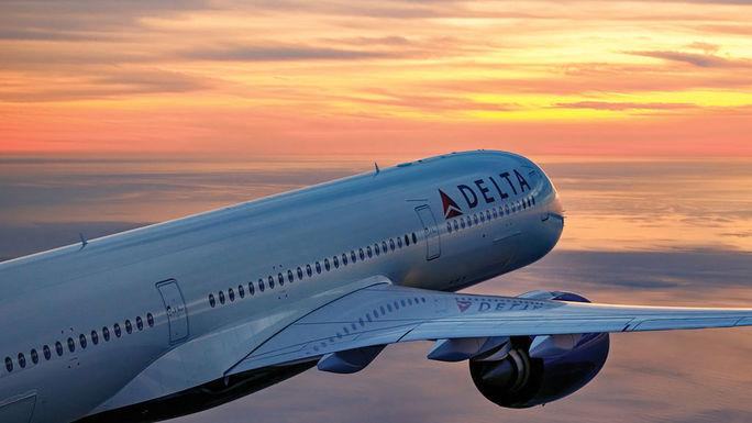 Delta Air Lines plane at sunset.