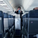 Flight attendant with beverage cart