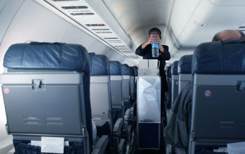 Flight attendant with beverage cart