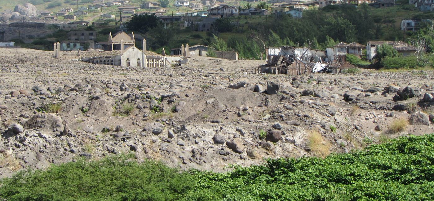 Image: PHOTO: The 1995 Soufriere Hills Volcano eruption buried the former capital of Plymouth in pyroclastic ash and mud. (Photo by Brian Major)