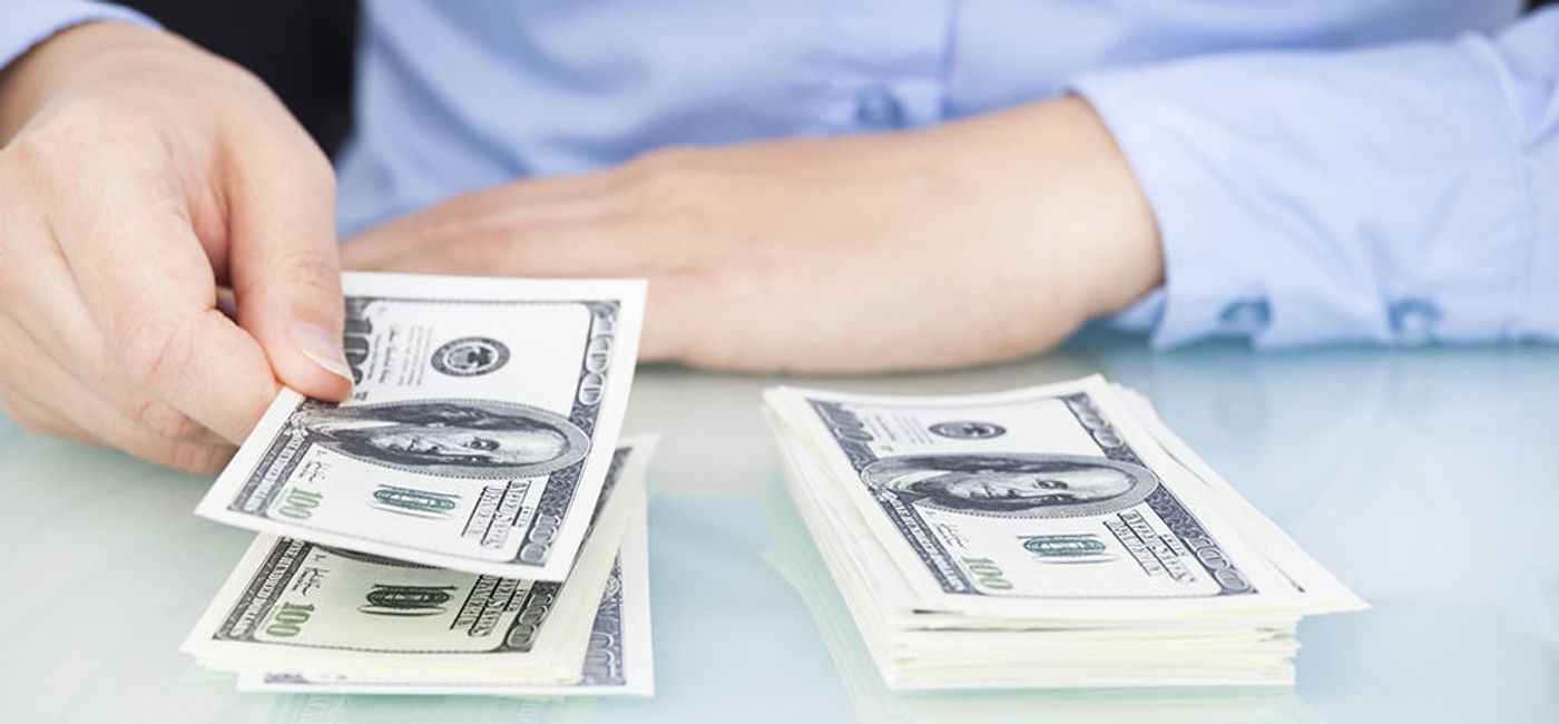 Image: PHOTO: Two stacks of cash. (photo courtesy of Thinkstock)