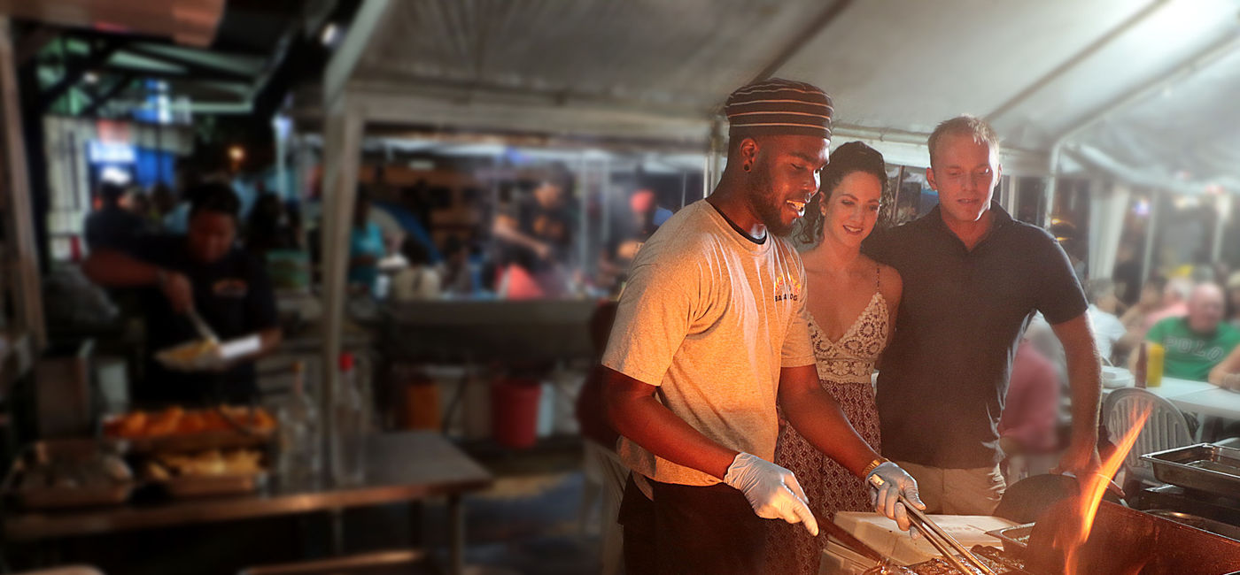 Image: Guests can enjoy freshly caught fish the local way at Oistins Fish Fry. (photo via BTMI) ((photo via BTMI))