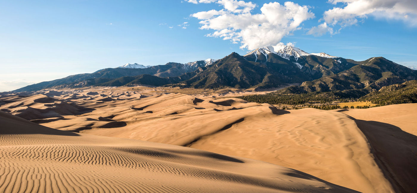 Photo: Sunset view of sand waves at the top of Great Sand Dunes National Park & Preserve, Colorado. (photo via SeanXu/iStock/Getty Images Plus)