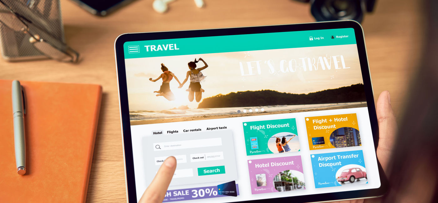 Image: Searching for vacation options online using a tablet. (Photo via iStock/Getty Images Plus/Sitthiphong)