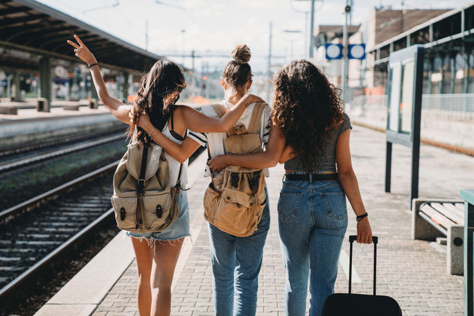 Three friends enjoy a trip together.