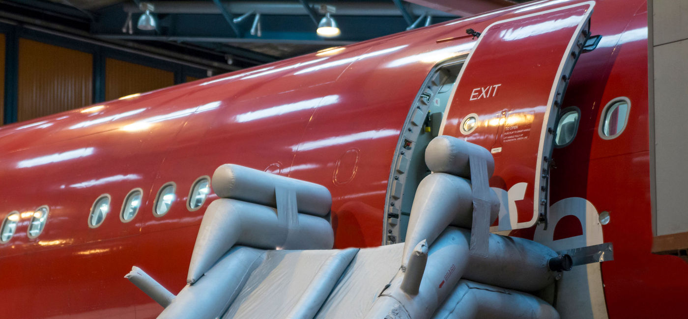 Image: PHOTO: Close up on emergency slider of wide body aircraft. (photo via MatusDuda / iStock / Getty Images Plus)