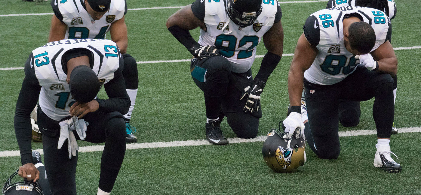 Image: PHOTO: NFL players kneeling. (photo via Flickr/Keith Allison) 