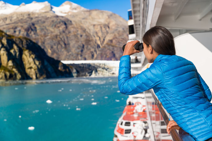Cruise ship passenger looking out at Alaska's Glacier Bay 