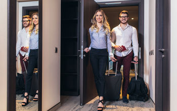 Couple entering their hotel room.