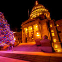 Beautiful Christmas tree decorated with colorful lights in front of Idaho State Capitol building in Boise, Idaho, USA