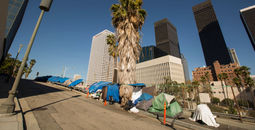 A homeless encampment next to a Downtown Los Angeles freeway.