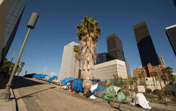 A homeless encampment next to a Downtown Los Angeles freeway.