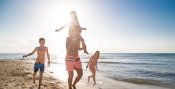 Family fun on the beach at Sandos Caracol