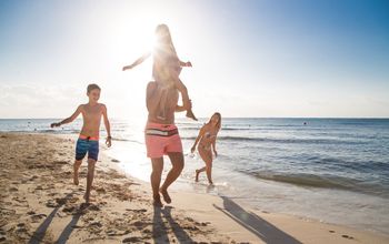 Family fun on the beach at Sandos Caracol