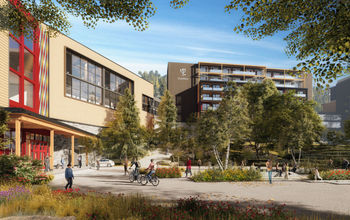 Outdoor shot of hotel building with cyclers and pedestrians in foreground