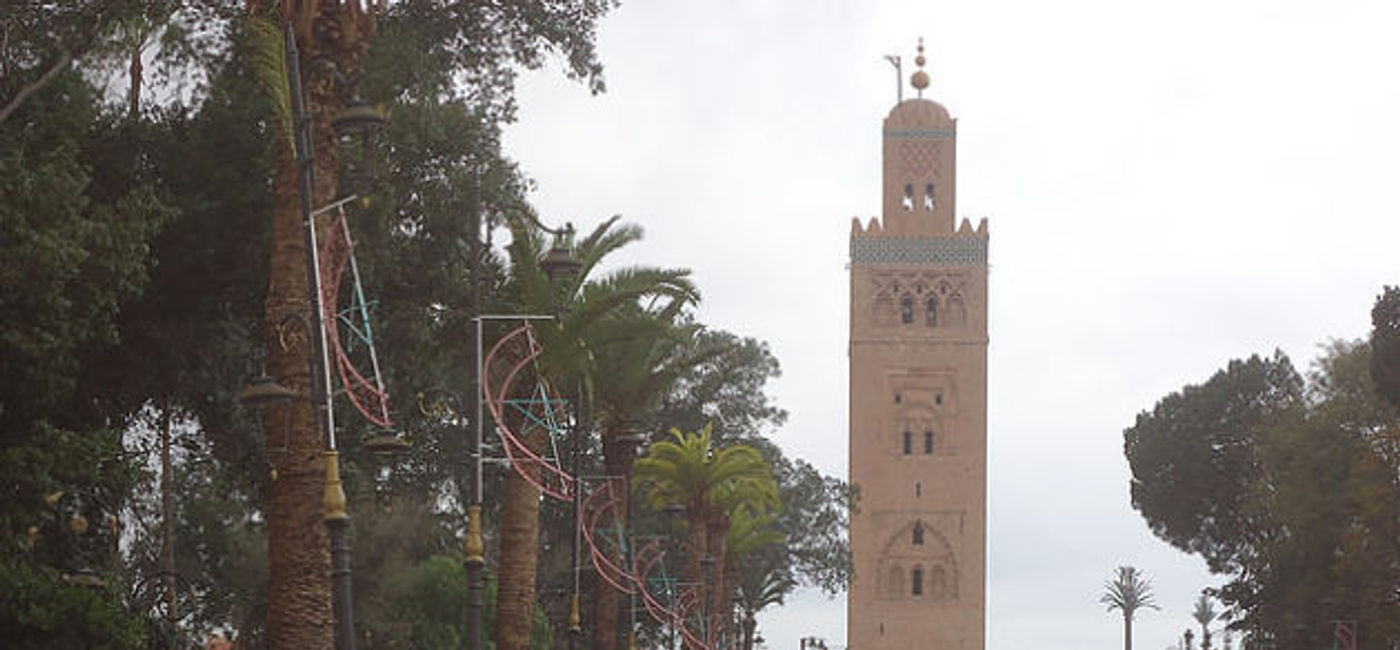 Image: PHOTO: A Marrakesh, Morocco street scene with Koutoubia Mosque's minaret in the background. (photo by Worldwide Scott)