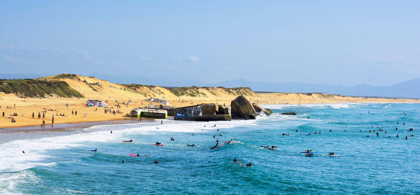 Image: PHOTO: Surfers off of Capbreton, France near Hossegor. (photo via gael_f/iStock/Getty Images Plus)