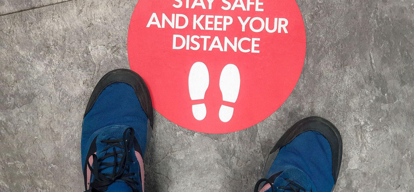 Image: PHOTO: Social distancing signage. (photo via georgeclerk/iStock/Getty Images Plus)