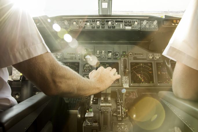 Pilots before take off, cockpit, airplane