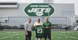 U.S. Virgin Islands Tourism Commissioner Joseph Boschulte with Jets officials