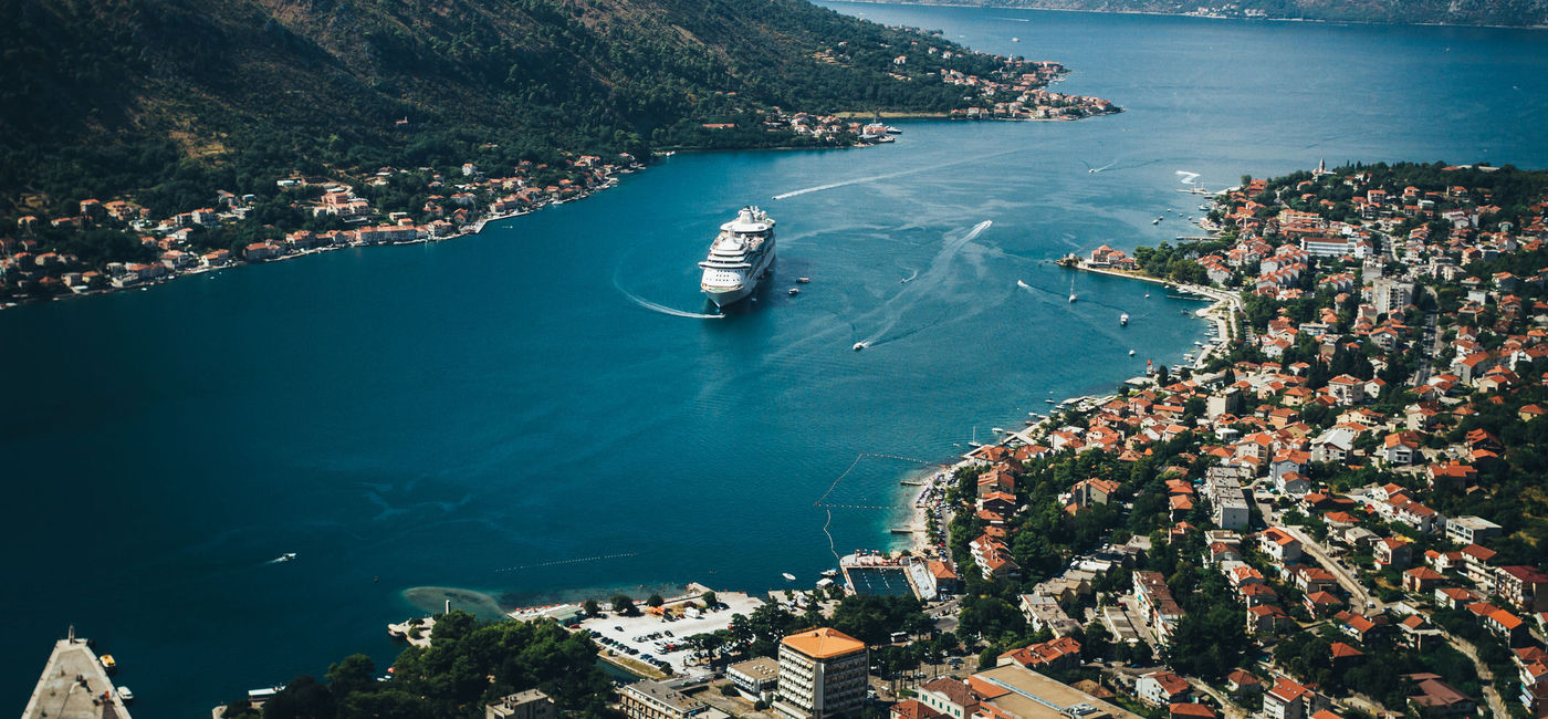 Image: Cruise ship in Kotor, Montenegro. (photo via CreativePhotoCorner/iStock/Getty Images Plus)