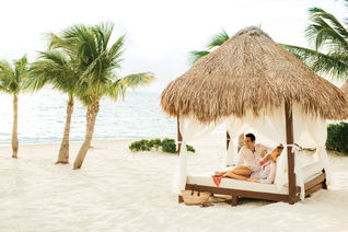 A couple relaxing at Excellence Playa Mujeres