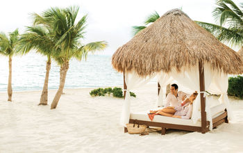 A couple relaxing at Excellence Playa Mujeres